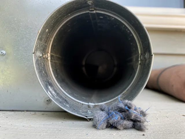 Rocky Hill Dryer Vent Cleaning technician using specialized equipment to clear severe dryer vent blockage in Rocky Hill